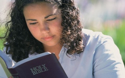 A-girl-reciting-holy-bible