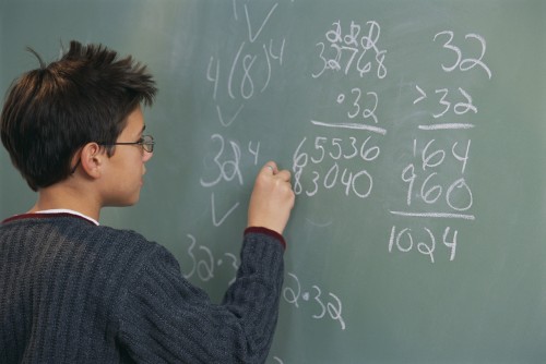 Performing Math Calculations at Chalkboard